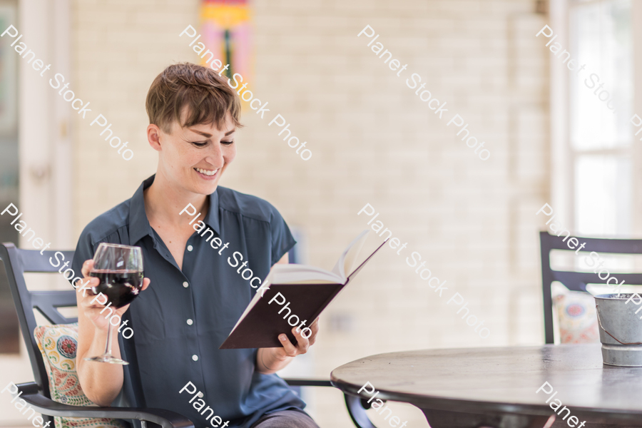 A young lady enjoying daylight at home stock photo with image ID: 3295a707-c097-4fbe-a22f-f5a8e709179d