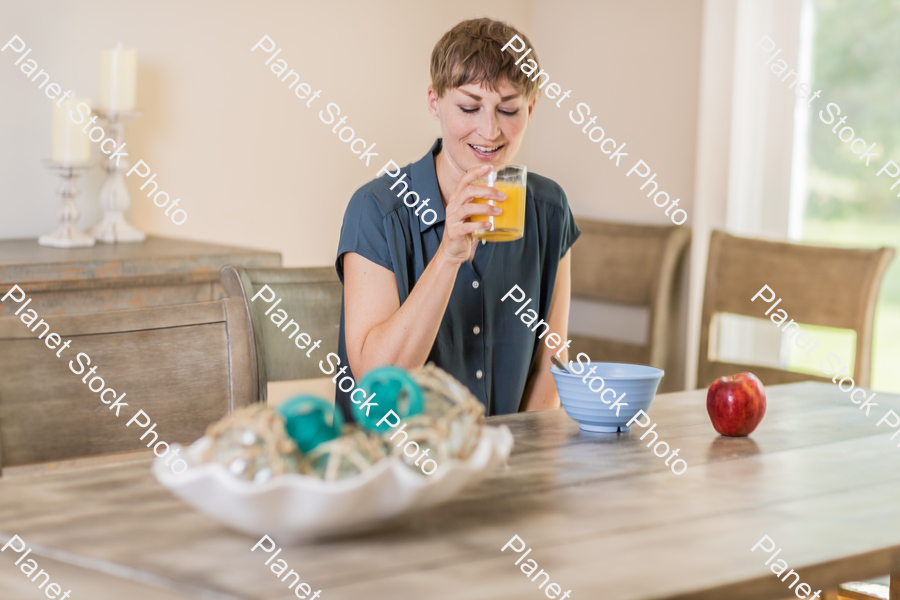 A young lady having a healthy breakfast stock photo with image ID: 3366d9fb-127a-475f-919a-d2810e502ca7