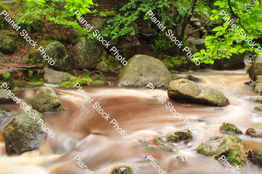 Water flowing over rocks stock photo with image ID: 343e610c-817e-45cc-a362-b68188e026a1