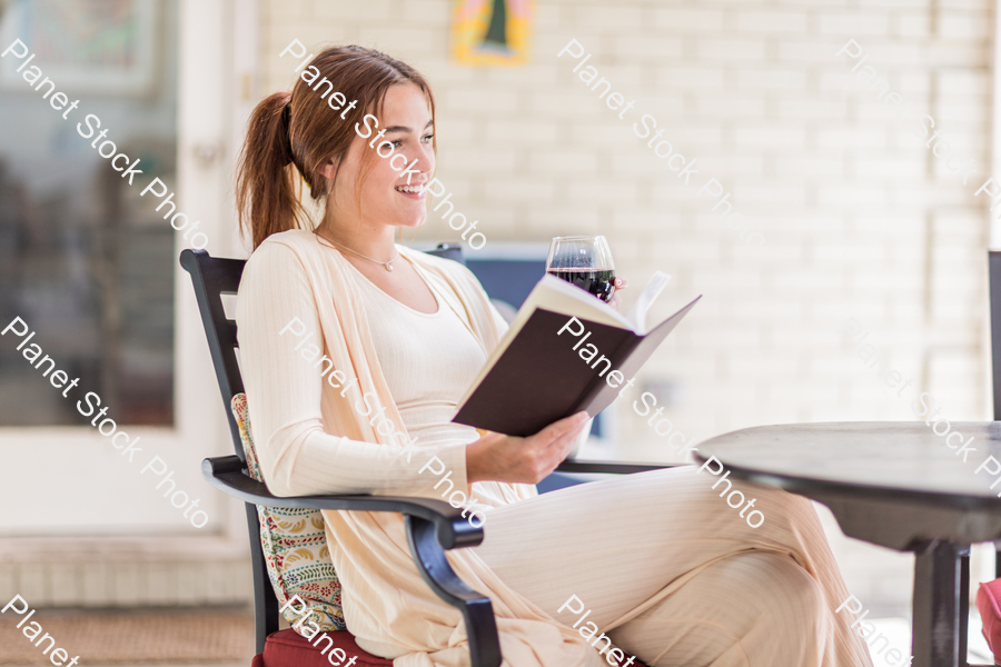 A young lady enjoying daylight at home stock photo with image ID: 34730516-8cea-4dcb-8b9d-de2ca0a0e40d