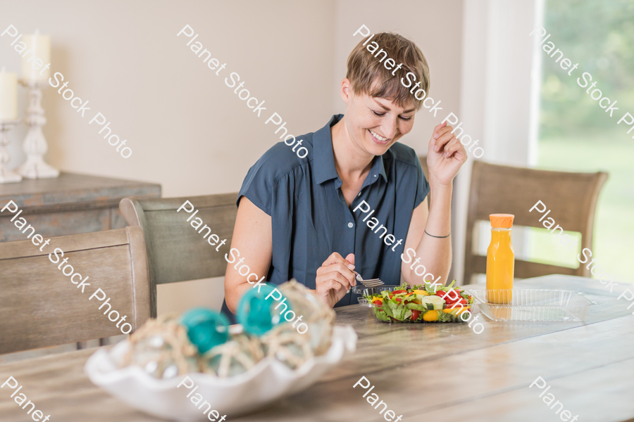 A young lady having a healthy meal stock photo with image ID: 36fd0cad-c8b2-41f0-b5df-32f316aadb09