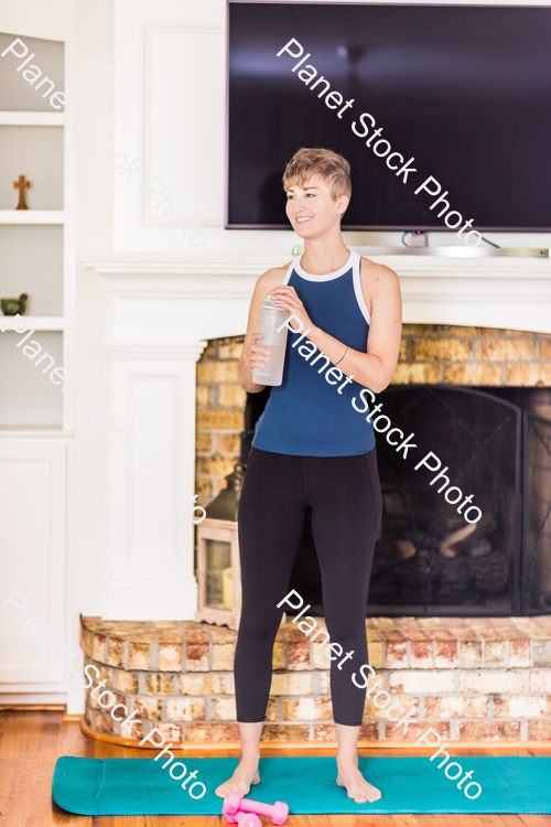 A young lady working out at home stock photo with image ID: 38d893dc-dd69-4b18-854e-6507f9177fb1