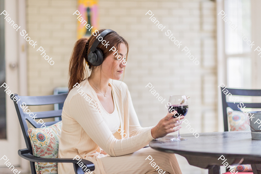 A young lady enjoying daylight at home stock photo with image ID: 396c7c55-dc65-4dcc-b79d-2d22e6267efa