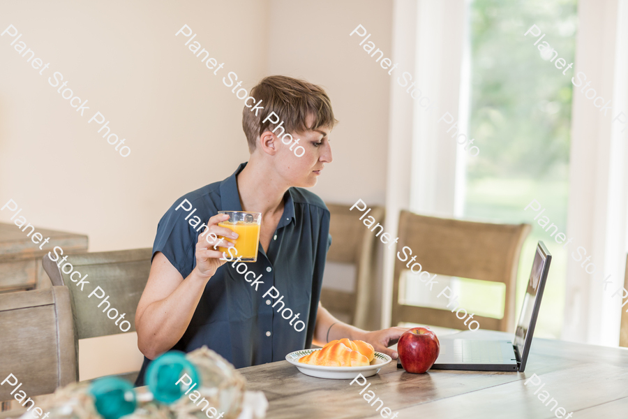 A young lady having a healthy breakfast stock photo with image ID: 39c8549e-ff28-400a-87bc-b370a468ff10