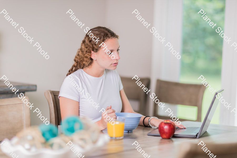 A young lady having a healthy breakfast stock photo with image ID: 3af75ebb-4216-47c8-8537-75292705842b