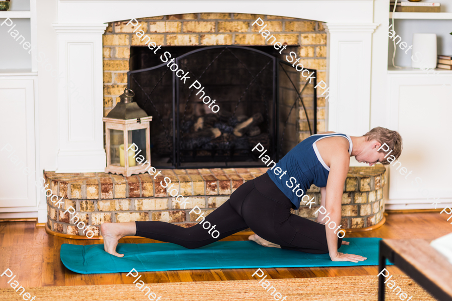 A young lady working out at home stock photo with image ID: 3ba11c80-1f48-4e23-9baa-0839a769ebc8
