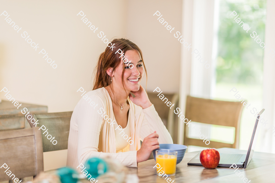 A young lady having a healthy breakfast stock photo with image ID: 3d1fd863-0e72-48e1-81fa-3bf202596f4b