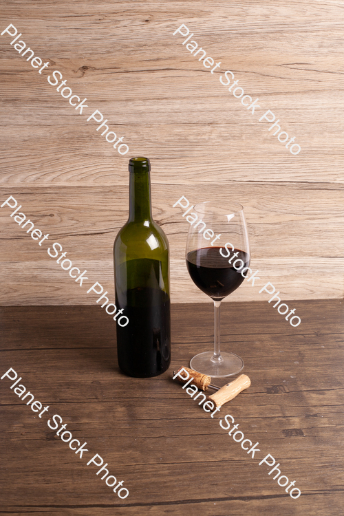 One bottle of red wine, with wine glass, and corkscrew stock photo with image ID: 3e218712-4481-43f7-b750-c3d42a2c8545
