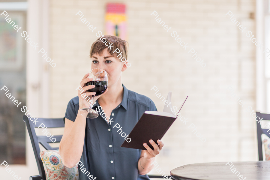 A young lady enjoying daylight at home stock photo with image ID: 3e36e769-eeca-4923-a869-58116a68b4cb