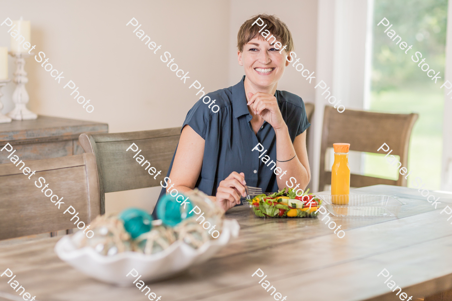 A young lady having a healthy meal stock photo with image ID: 3f657bf8-9036-4d44-a07e-7c6e138de0d8