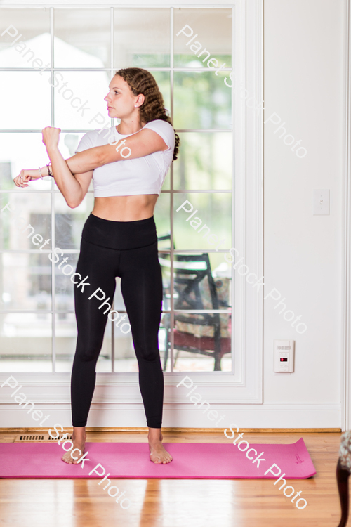 A young lady working out at home stock photo with image ID: 4082f84c-4b31-4537-a16e-d9c7804f76a1