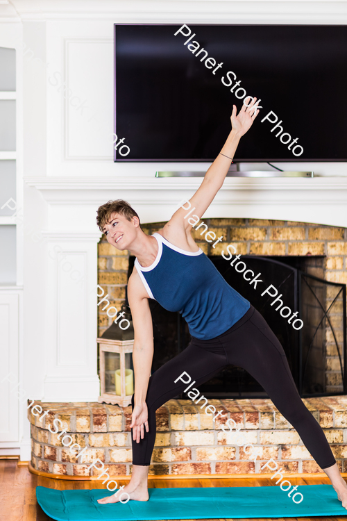 A young lady working out at home stock photo with image ID: 4260a756-3610-49c0-8a3e-2a4000a2922b