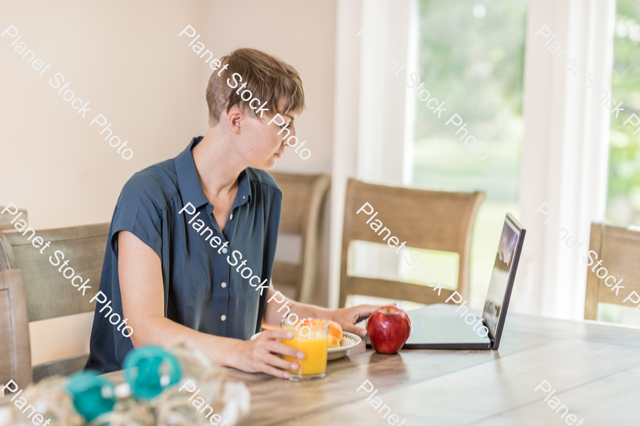 A young lady having a healthy breakfast stock photo with image ID: 43a14838-b7eb-43d1-b69c-bdc7dab7d8e9