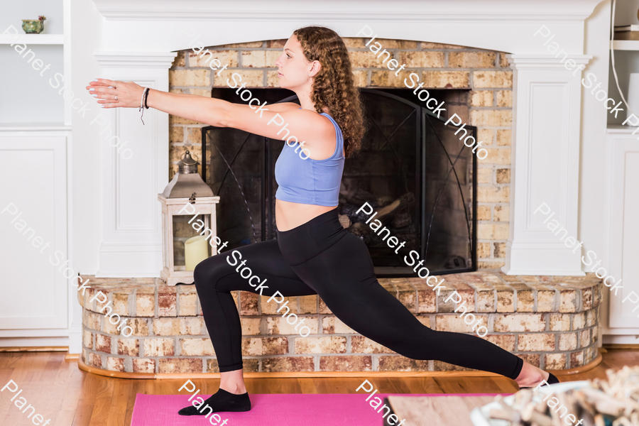 A young lady working out at home stock photo with image ID: 452bacf7-f726-4409-af2d-97bb473a7c8d