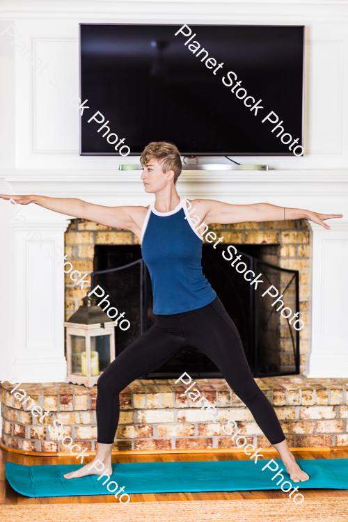 A young lady working out at home stock photo with image ID: 480ca661-76a0-412f-885f-262a5dbe1e52