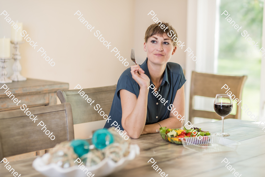 A young lady having a healthy meal stock photo with image ID: 49fda06a-722f-4638-b56e-439ef2d1edc1