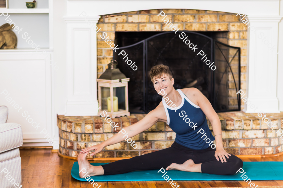 A young lady working out at home stock photo with image ID: 4ca0fa97-acf3-43c5-ae09-15ab640e9960
