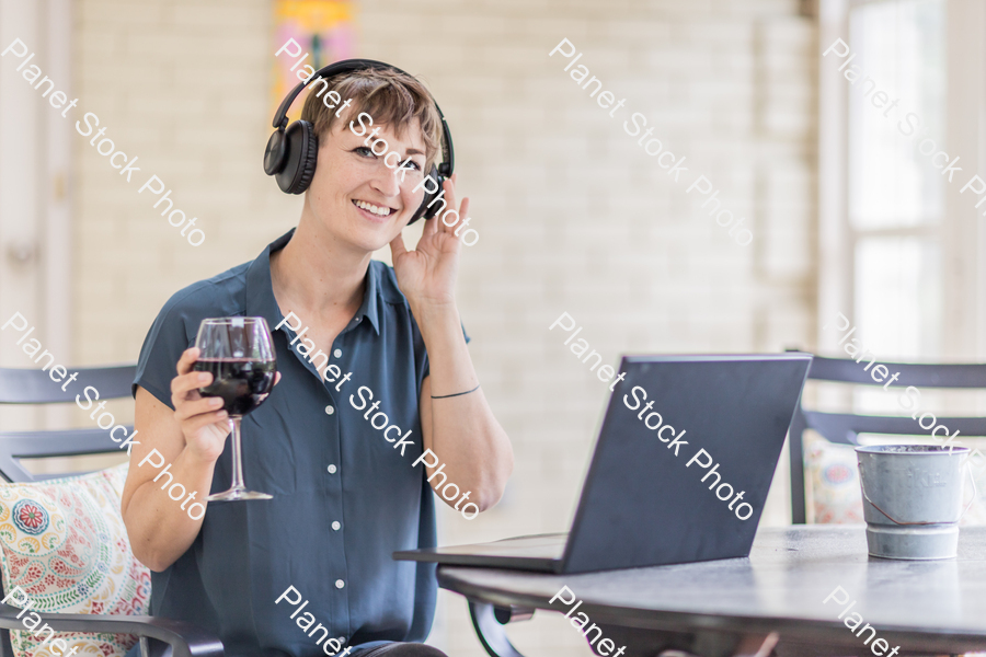 A young lady enjoying daylight at home stock photo with image ID: 4d5fe691-b183-4029-964d-2e89f53e2415