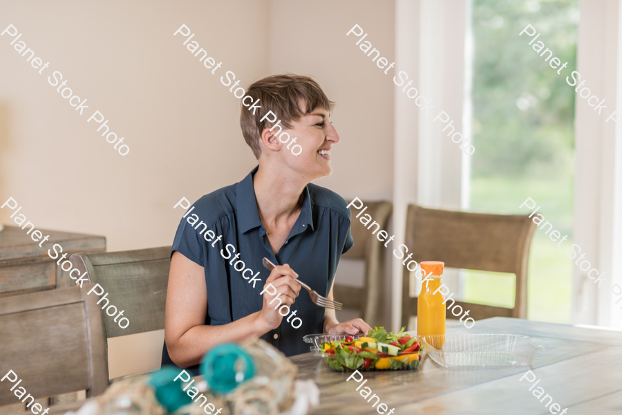 A young lady having a healthy meal stock photo with image ID: 4d7382f8-1668-416d-914e-743e7993cd3c