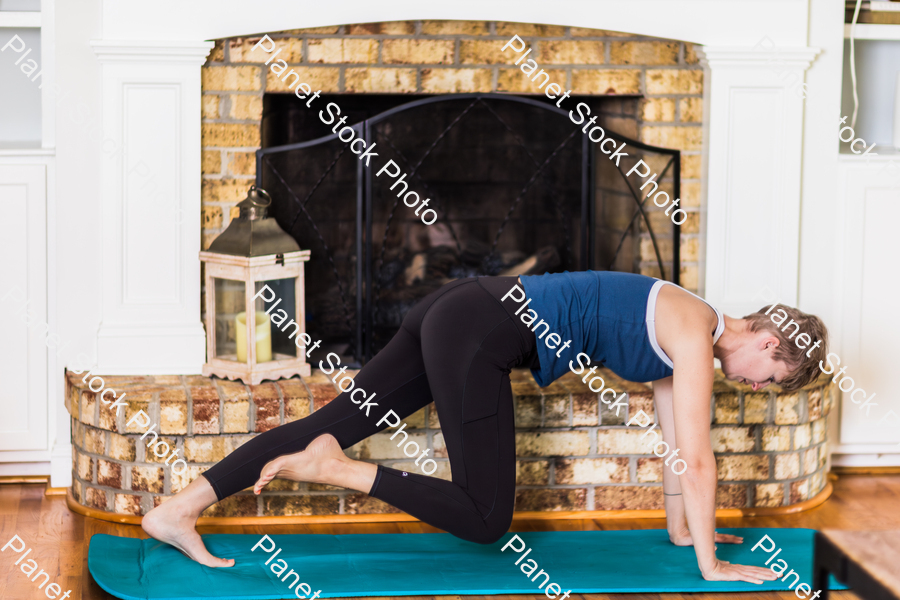 A young lady working out at home stock photo with image ID: 511dd737-8e46-4129-9957-86edd461cd13