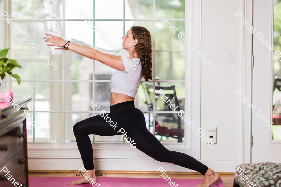 A young lady working out at home stock photo with image ID: 52c60988-f76d-43da-b674-1354c9c6a986