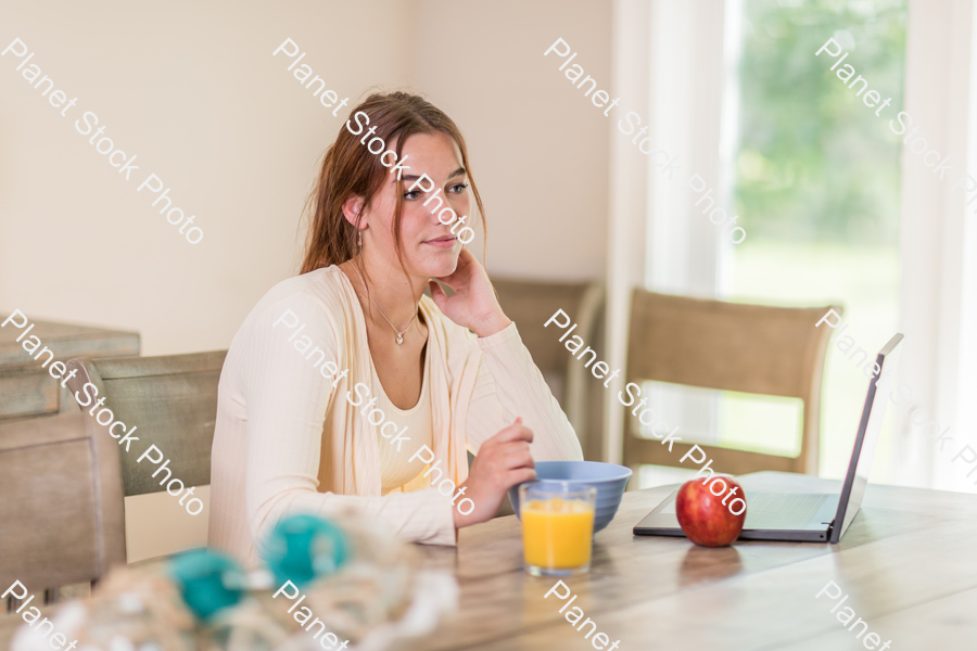 A young lady having a healthy breakfast stock photo with image ID: 538c856a-1d0b-47be-b819-85cb0d23a71f