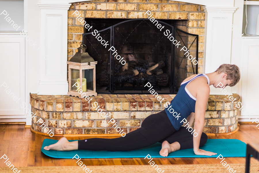 A young lady working out at home stock photo with image ID: 54031c6f-3e48-4c80-af57-6a56f35f84eb