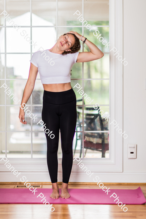 A young lady working out at home stock photo with image ID: 5563a87c-48b0-4ba4-98e0-9ed91b595f84