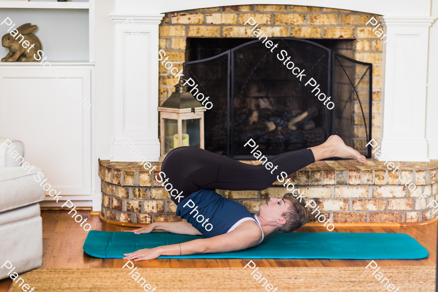 A young lady working out at home stock photo with image ID: 561db169-6dd4-459e-8800-bbf92cd4963e