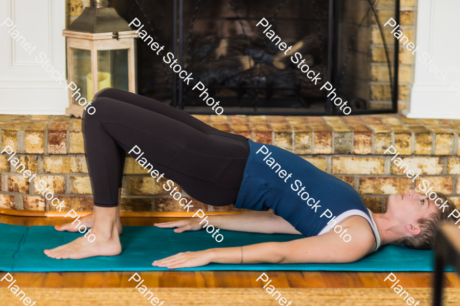 A young lady working out at home stock photo with image ID: 56dd3165-2d0b-4dc5-a011-94c79b24c432