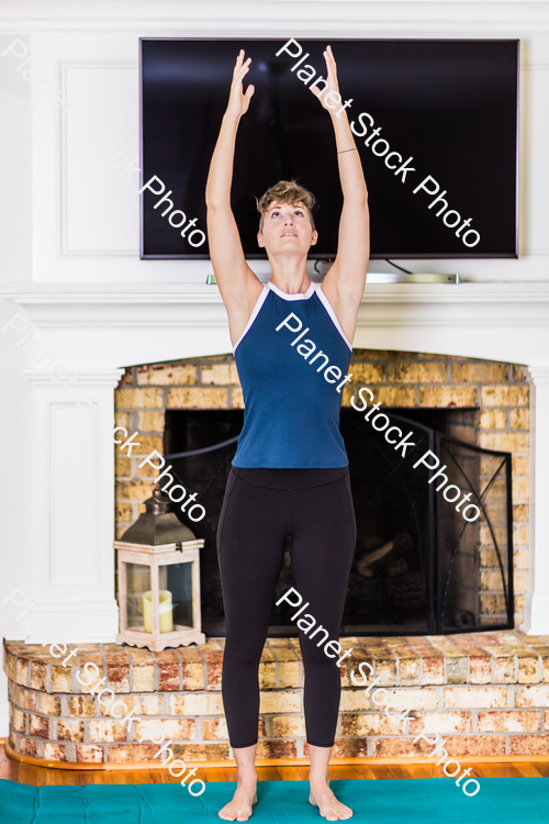 A young lady working out at home stock photo with image ID: 572b62c1-bff8-44b5-93d4-0d3b61e030c8