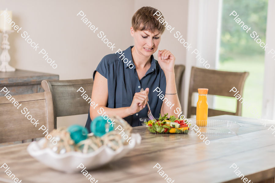 A young lady having a healthy meal stock photo with image ID: 579c15cc-10db-4f07-941c-2d7f7ec6ba5b