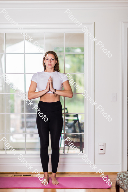 A young lady working out at home stock photo with image ID: 581c0ae7-492e-42e4-acf7-8163c1273152