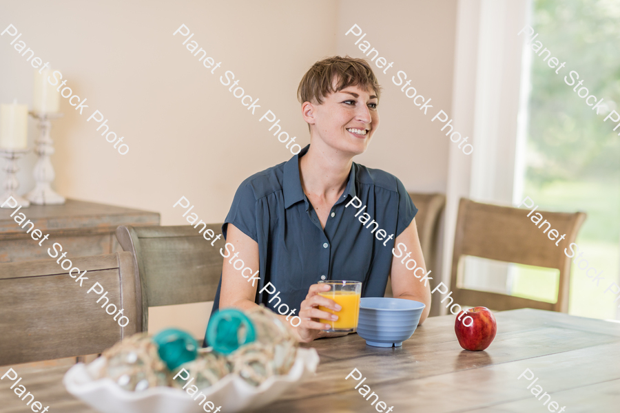 A young lady having a healthy breakfast stock photo with image ID: 59e7ab76-3dbf-48a4-bfb0-a76d934e4c94