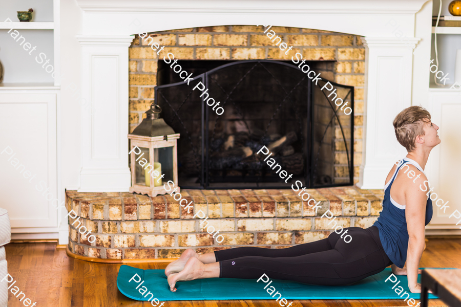 A young lady working out at home stock photo with image ID: 5aa77d26-f714-4aab-823e-21c6c4f7f978
