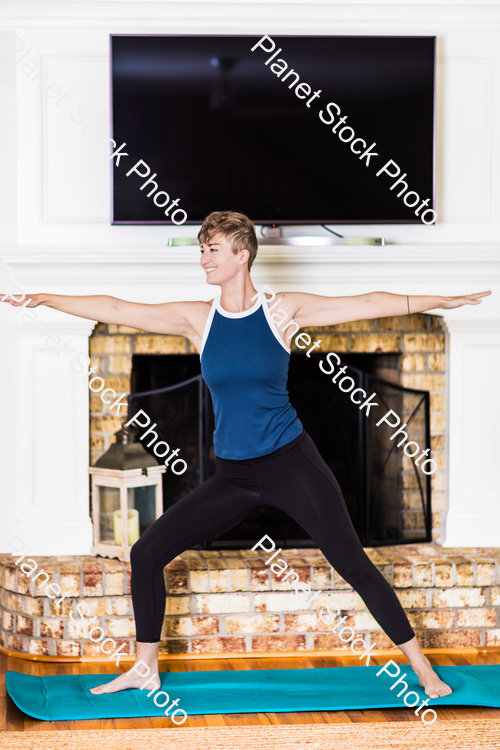 A young lady working out at home stock photo with image ID: 5b6bcc61-558d-4eca-bb0a-56540e0fc1f6