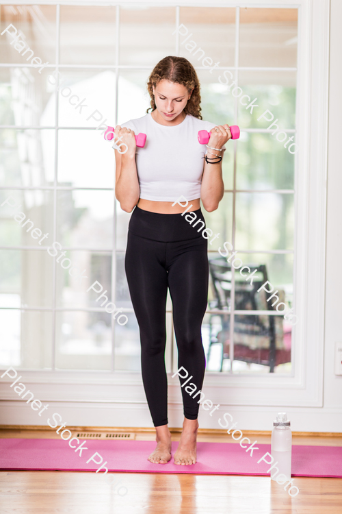 A young lady working out at home stock photo with image ID: 5c67e90a-d5ee-4077-a4fc-d36c0a8b1745