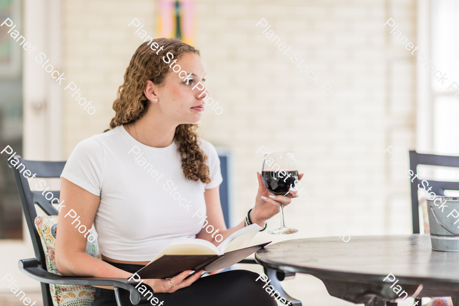 A young lady enjoying daylight at home stock photo with image ID: 5cc09cf2-be42-46ad-b11f-117219db1903