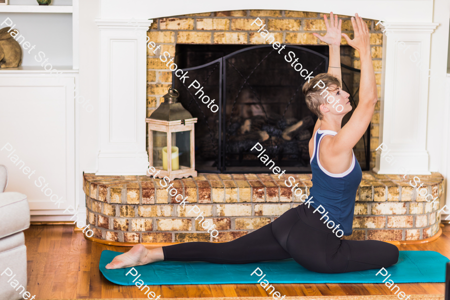 A young lady working out at home stock photo with image ID: 5ee64891-ccff-42cb-9001-69141c2c13dc