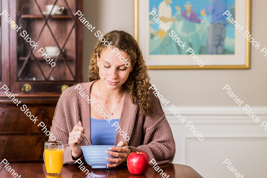 A young lady having a healthy breakfast stock photo with image ID: 615c2ab9-9b2b-442e-9f43-ee1b98001e43