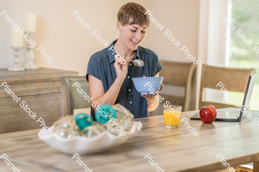 A young lady having a healthy breakfast stock photo with image ID: 6235a7f2-ed66-4348-989f-1827a38a5179