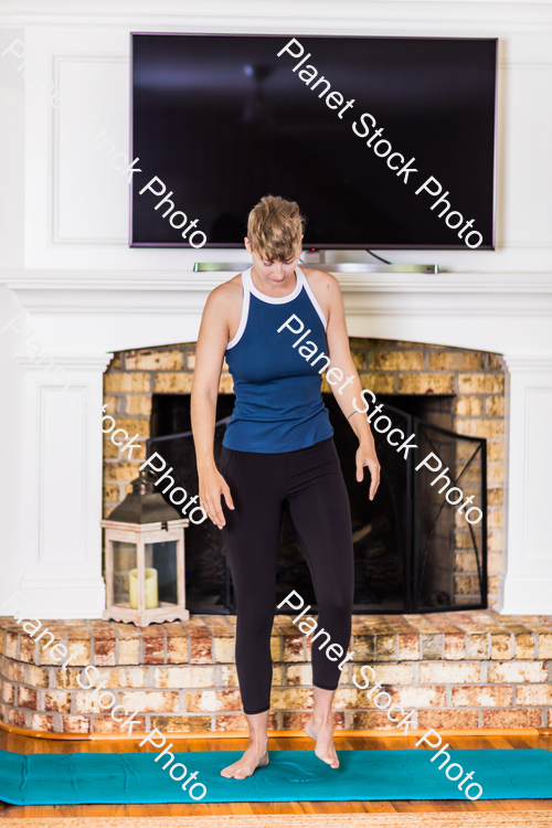 A young lady working out at home stock photo with image ID: 629600b7-fe26-4a75-a8b0-015ed81adb03