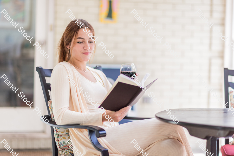 A young lady enjoying daylight at home stock photo with image ID: 63e1f663-2030-42bf-b4c9-1eeb9082efdd