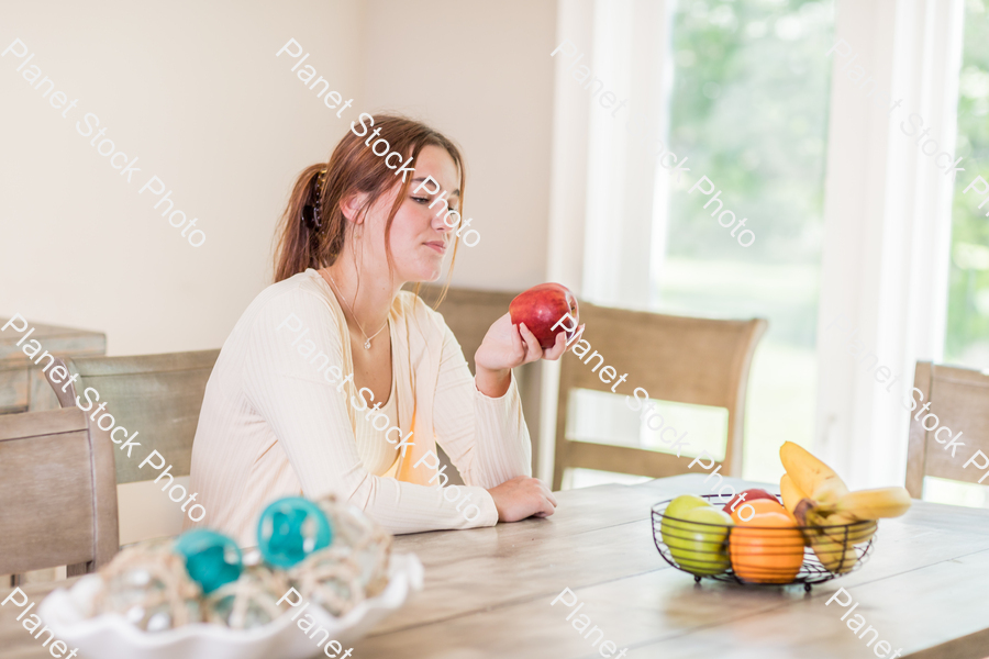 A young lady grabbing fruit stock photo with image ID: 645df992-f779-4e0b-b46b-38e096cf3f69