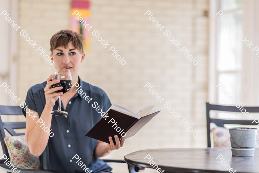 A young lady enjoying daylight at home stock photo with image ID: 64ae0925-ed07-4ca0-a238-314a3bbfa23c