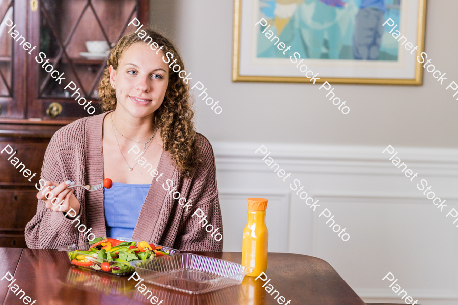 A young lady having a healthy meal stock photo with image ID: 65962949-f8f6-44be-adec-683abb62673b