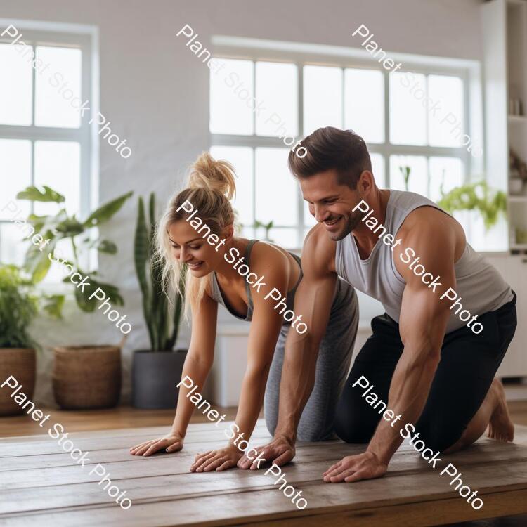 A Young Couple Working Out at Home stock photo with image ID: 670ed12a-a6cb-4c9f-a870-bb434bc7acd2