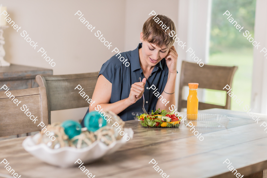 A young lady having a healthy meal stock photo with image ID: 68173973-acca-4bcb-9137-c663129bc418