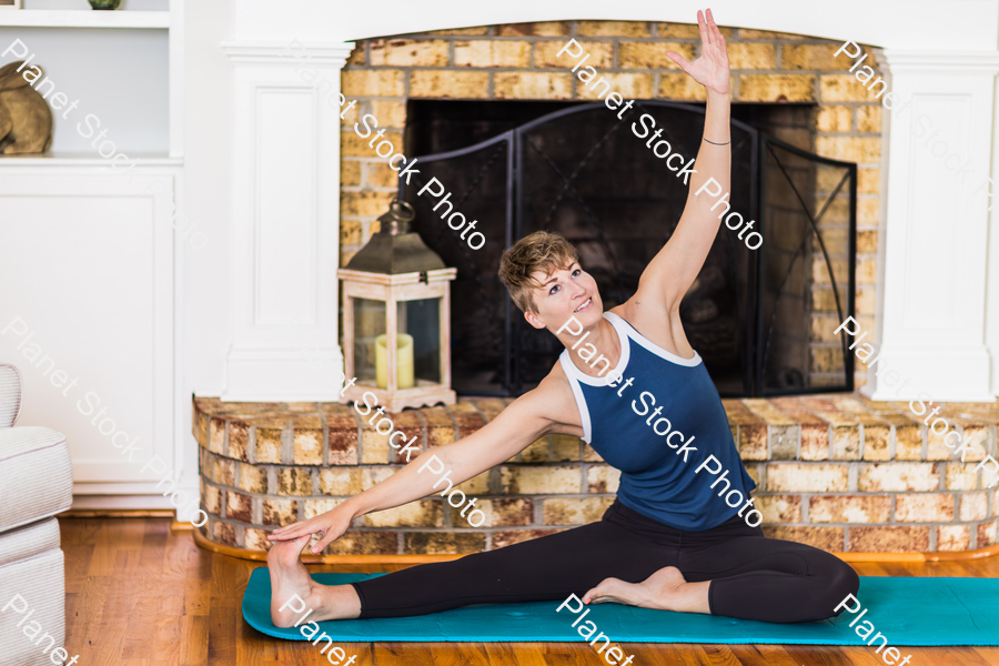 A young lady working out at home stock photo with image ID: 6825b727-7aff-4d18-b7ce-88b0d7967d8f