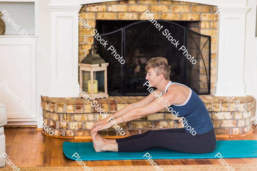 A young lady working out at home stock photo with image ID: 6a208593-b78f-40dd-9571-2a7336032609
